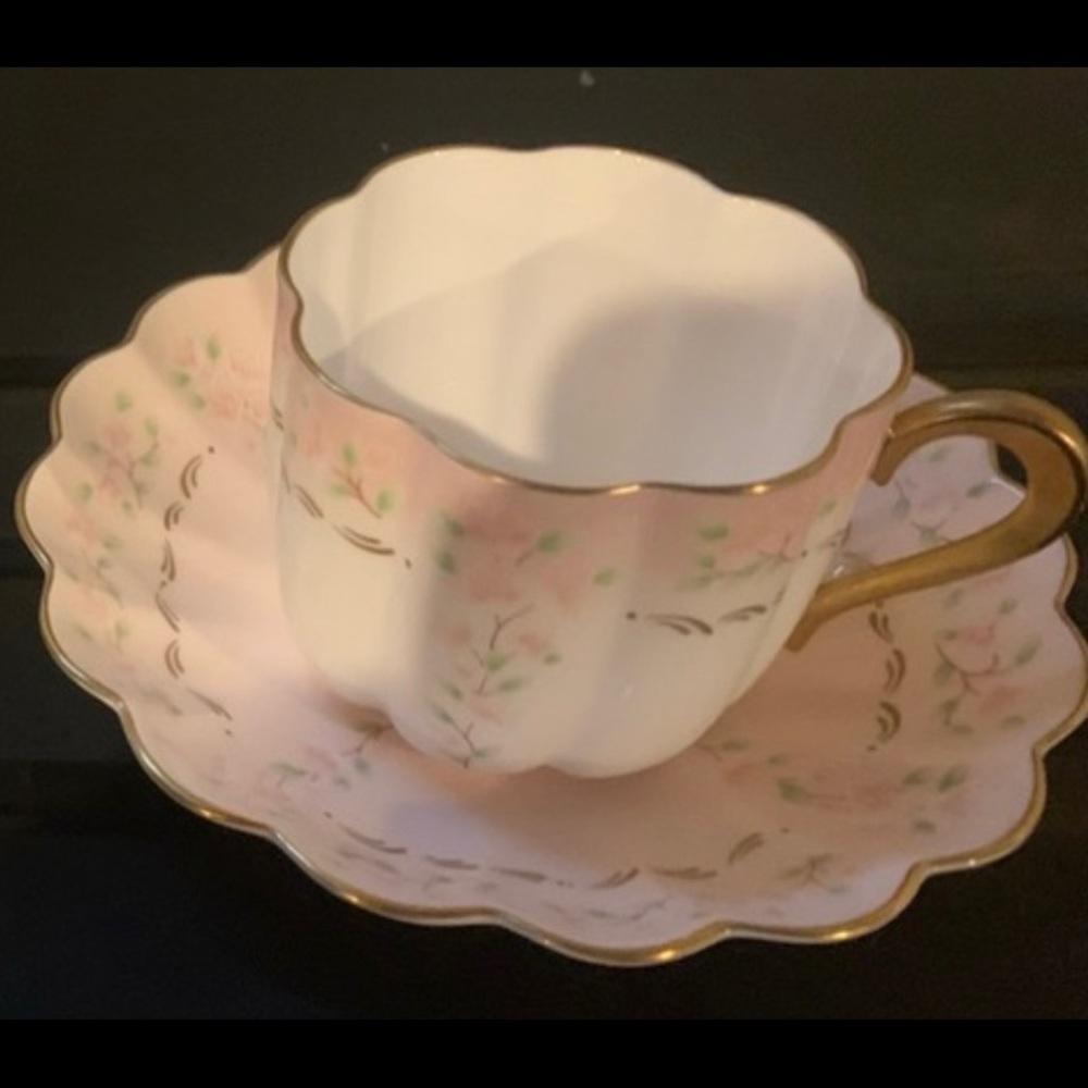 Antique cup and matching saucer. Sweet & delicate.